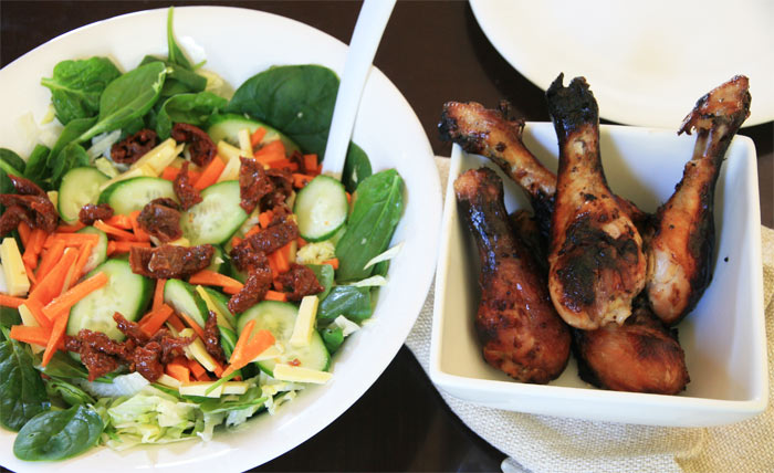 Marinated chicken drumsticks and salad
